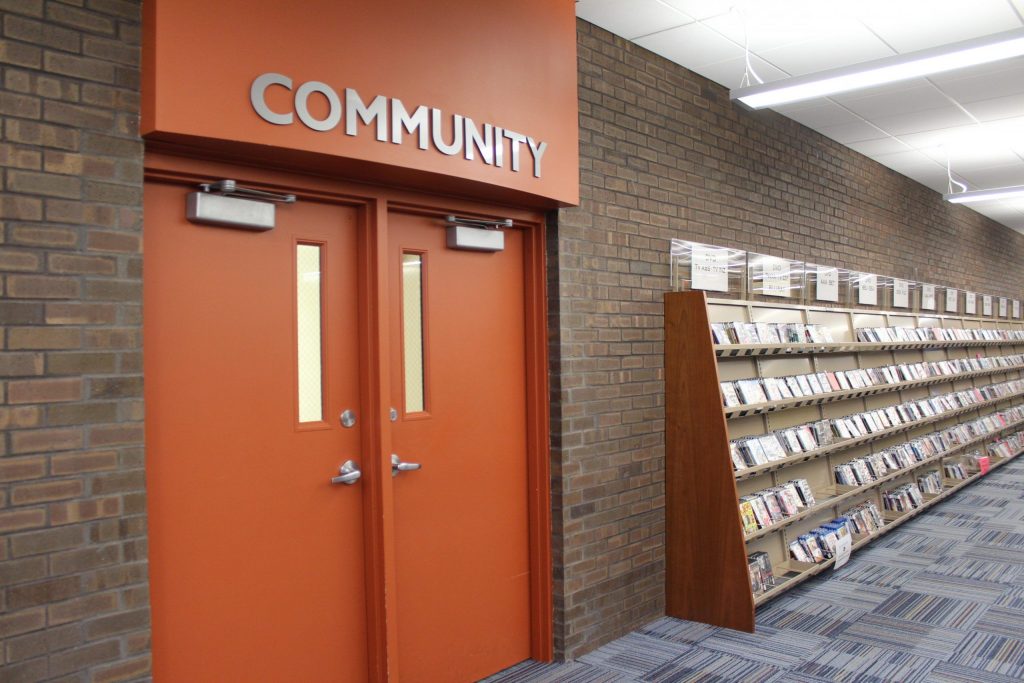 Reddick Library's Community Room Doors and shelves with various media