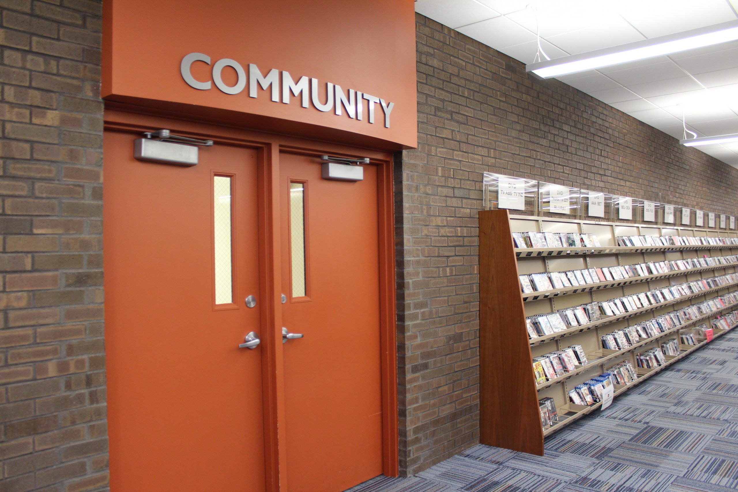 Reddick Library's Community Room Doors and shelves with various media