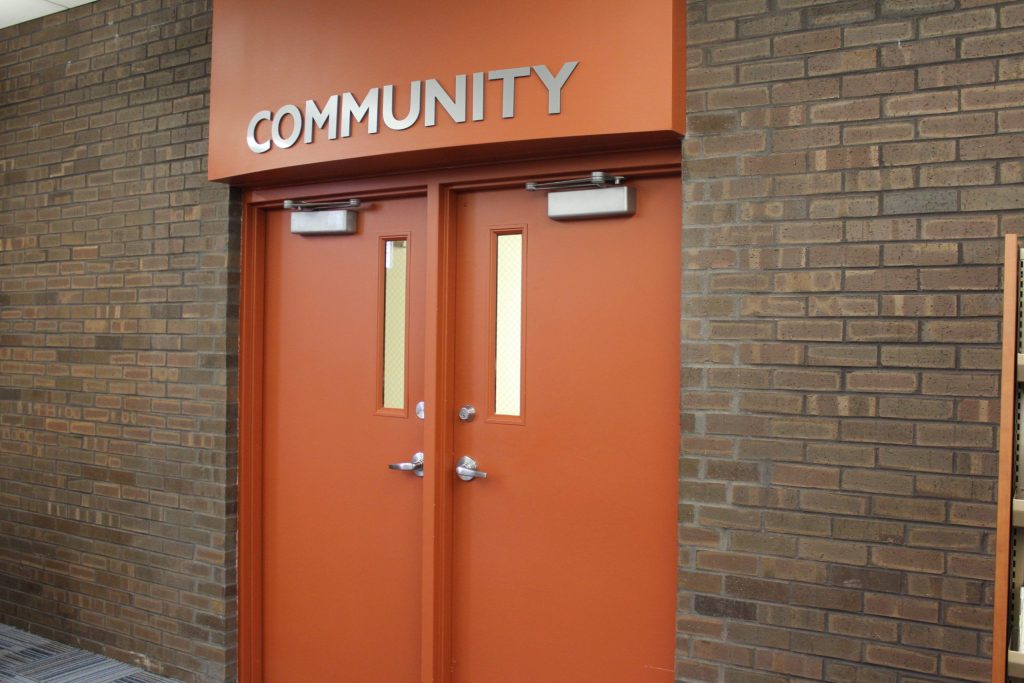 The doors of the Community Room at Reddick Public Library.