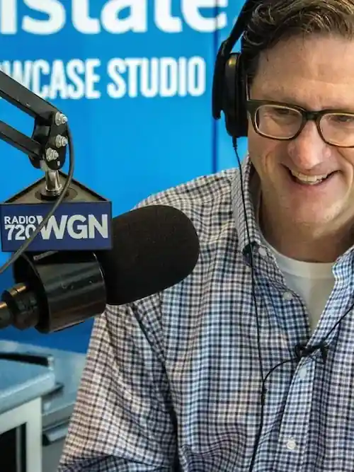 Commentator from WGN Radio speaking into mic